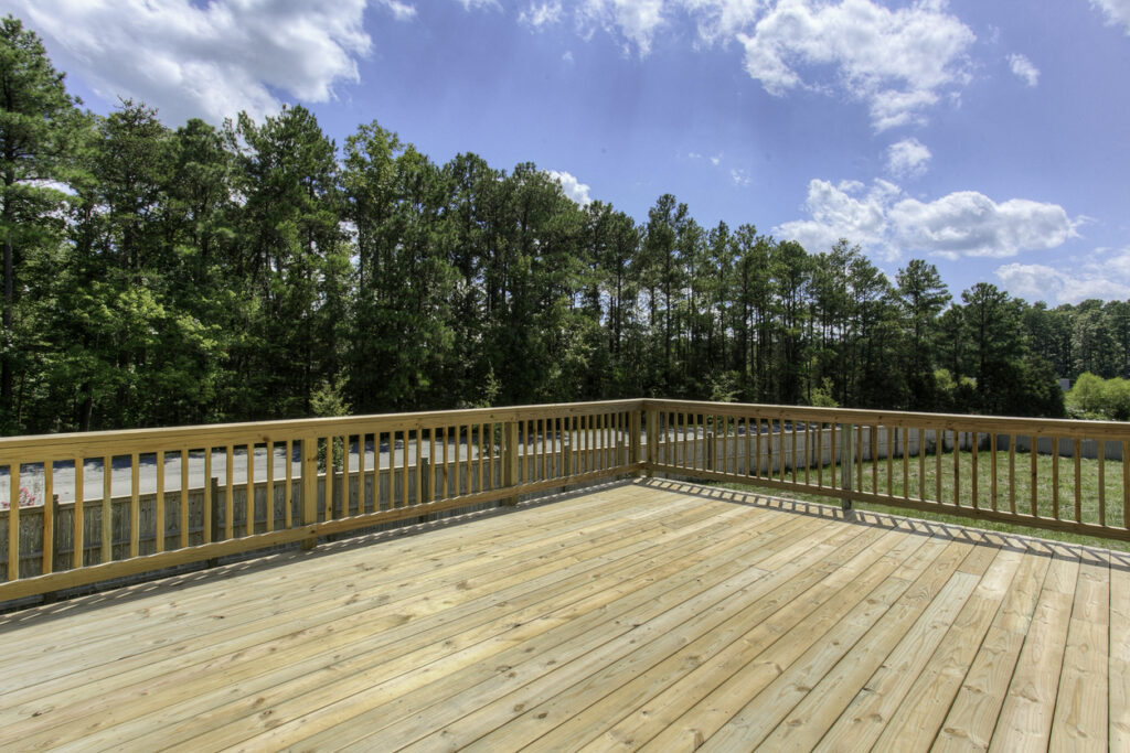 How to Choose the Best Waterproof Decking Material for Your Climate - All Climate Roofing & Construction